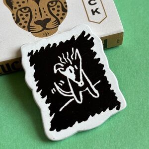 Fido Dido’s DOG on a pin (part of the 7-Up partnership)